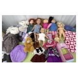 Lots of baby dolls, clothes, blankets