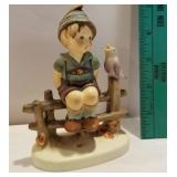 Hummel - boy on fence with bird