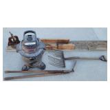 Shop vac, pitch fork, pipe vise