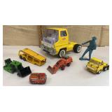 Box of toy trucks & a cowboy