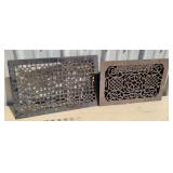 2 cast iron floor grates