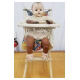 Doll and high chair, 1950s doll