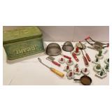 Bread tin, red and green handle cookie cutters,