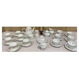 Box of mixed China & a pretty slag bud vase