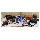 Box of digital & film cameras w/ bags &