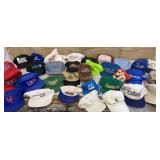 Box of baseball caps - many are vintage