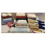 A large clear tub bath towels, flat twin sheets,