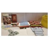 Fabric material, small plastic tub of thread,