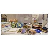 Clear tub of quilting material, quilting books,