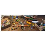 2 boxes toys - PEZ, action figures, cars, trains,