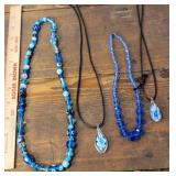 4 blue glass necklaces