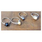 4 Pearl rings - signed ster.
