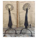 Wrought iron andirons w/ brass medallions