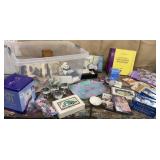 Clear tub of misc households - sound spa, fabric,