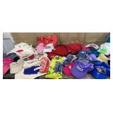 Box of new hats, backpacks, canvas totes etc