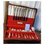 Set of community flatware in wooden chest