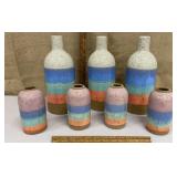 Box of colorful pottery vases