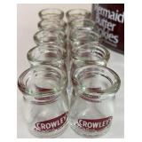 10 Crowley coffee creamers in a metal tin