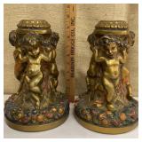Pair of heavy bronze cherub candlesticks