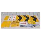 A lot of metal road signs and no trespassing sign