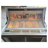 Seeburg jukebox w/records - it plays most of the