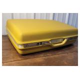 Retro yellow Samsonite luggage