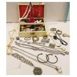 Jewelry box with necklaces, earrings, bracelets,