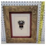 Early gold frame with family crest
