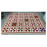 Red & white patterned quilt approx 69"x84"