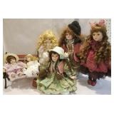 Porcelain dolls, wooden love seat