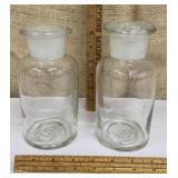 Pair of German glass apothecary bottles w/ lids -