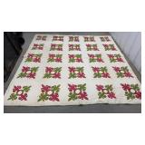White quilt w/ green & red pattern approx 82"x82"