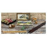 Leather strap, framed print, Esso 1953 scrapbook