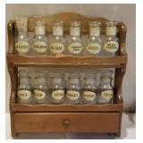Wooden spice rack with spice bottles