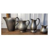 4 pewter pitchers