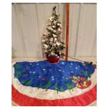 Small Christmas tree with lights, tree skirt