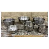 Stack of various stainless mixing bowls