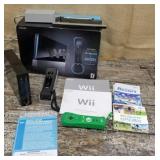 Wii system, 2 remotes, information books, game,