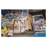 3 piled up boxes mostly sports ephemera