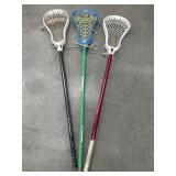 3 lacrosse sticks