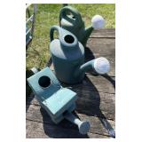 3 water can 2 plastic one tin