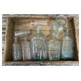 Wooden crate of old bottles