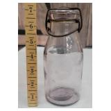 Early lock top amethyst milk bottle with original