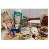 Fabric pieces, ribbons, scissors, crafting