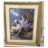 Pretty little girl with her toes in the water