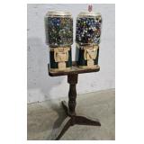 Double candy dispenser full of marbles with key