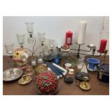 Small bin of candles and candle holders, brass