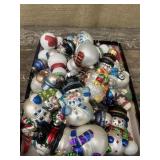 Snowman ornaments with fancy hooks. Most are