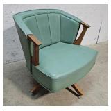 Mid century swivel arm chair