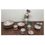 Geisha figurines and geisha plates, mugs, and